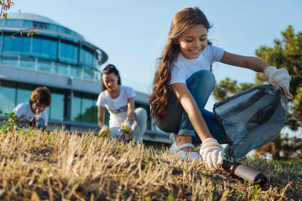 Students volunteering outside in the community