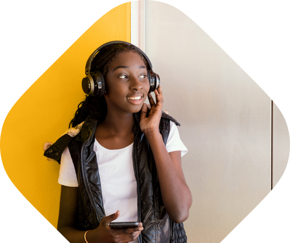 Banner image of thank you page - young woman with headphones looking to the left.